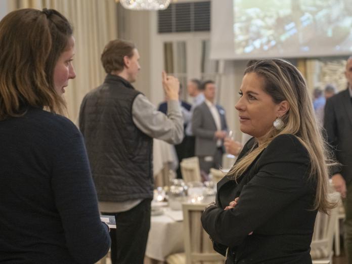 Two Energy Leap partners discussing and exchanging views at the annual meeting in Energy Leap